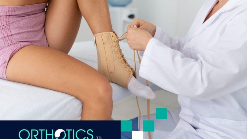 A medical practitioner helping a kid fit a pediatric orthotics