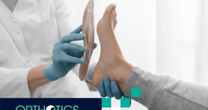 A professional is helping a patient fit an orthotic insole